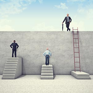 Three men facing various stages of success in scaling a wall.